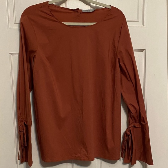 Anthropologie Tops - Perfect pumpkin colored blouse with flared tied sleeves….so cute!!